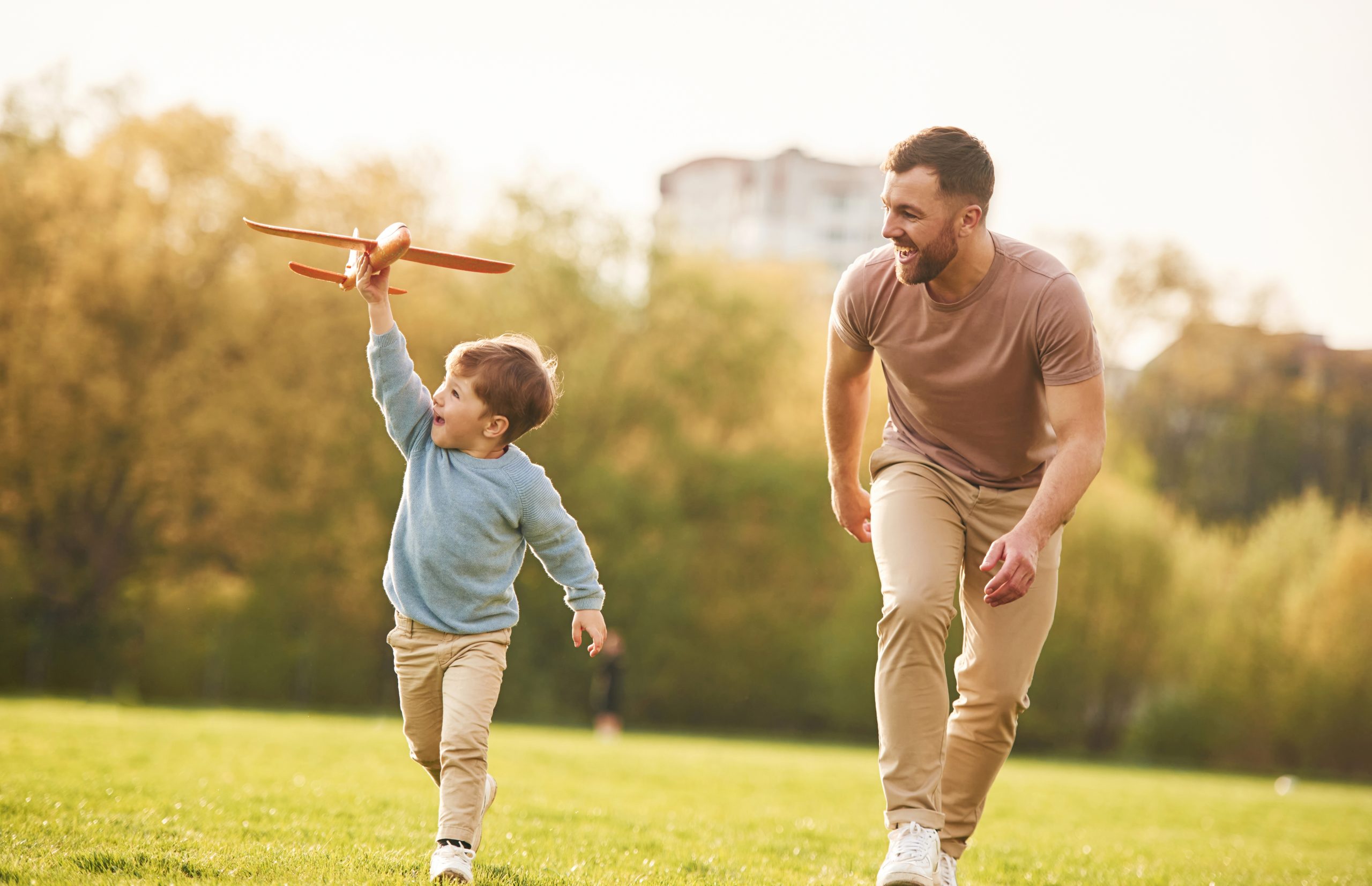 Summertime,Happiness.,Running,With,Toy,Plane.,Father,With,Son,Are